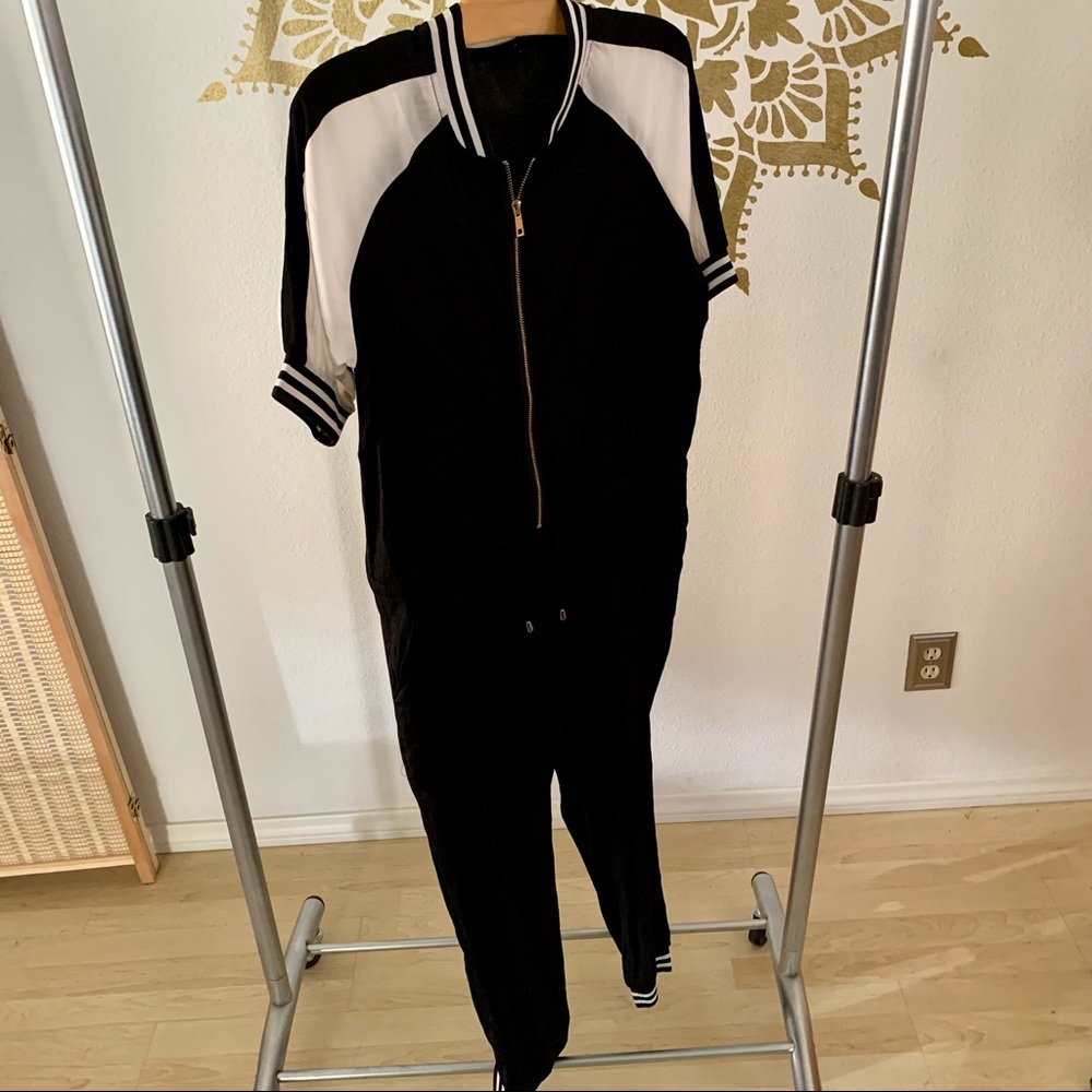 Super cute black and white sporty jumpsuit. Size M
